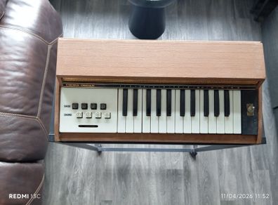 Vintage electric organ on stand