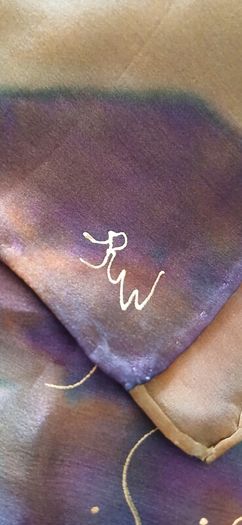 Hand painted, 100% silk scarf featuring a hand-rolled hem and custom metallic gutta detailing.