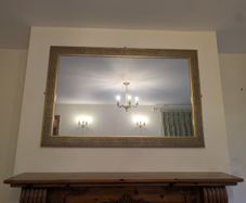 Mirror and matching gold light fittings