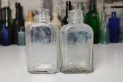 339 - Set of 2 Vintage Clear Glass Collectible Decorative Medicine Bottles