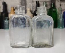 339 - Set of 2 Vintage Clear Glass Collectible Decorative Medicine Bottles
