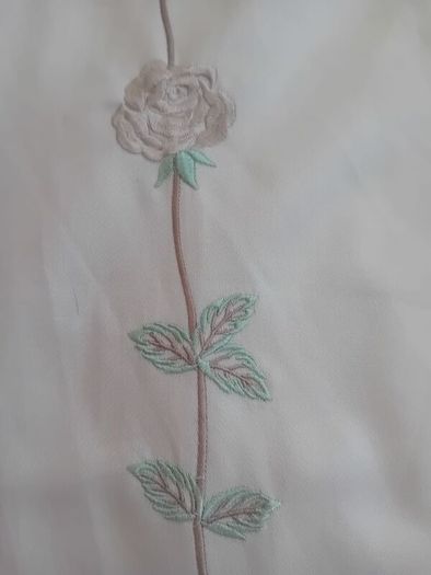 A pair of vintage embroidered curtains