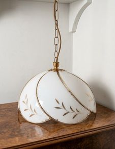 vintage 1970s Hollywood Regency-style milk glass swag lamp with gold leaf detailing