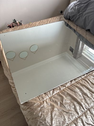 big rimless mirror that screw to wall. Have the 4 screws. In perfect condition. Box for transport
