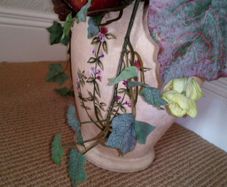 Artificial Dried Flower Arrangement in Pottery Urn.