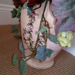 Artificial Dried Flower Arrangement in Pottery Urn.