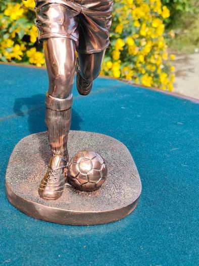 Two Gilded footballers
