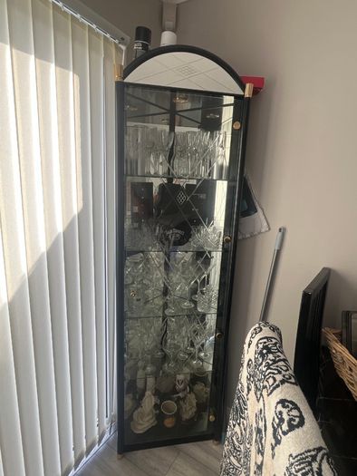 Table and chairs and glass cabinet