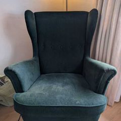 High backed winged armchair