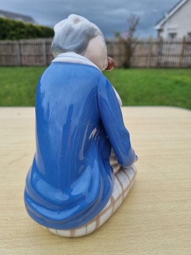 Porcelain sleeping clown with ball
