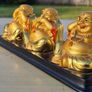 Three brass Buddha figurines Image 3