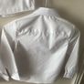 3 dunnes white shirts (new/as new) age 6-7 Image 9