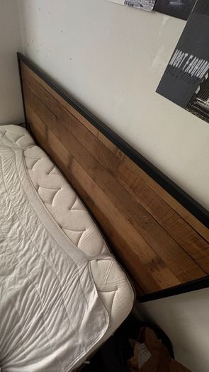 Black metal frame with wooden accent headboard