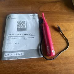 Heated eyelash curler