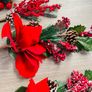 Collection of artificial red poinsettia and berry Image 3