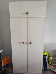 White wooden wardrobe with shelves