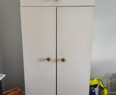 White wooden wardrobe with shelves