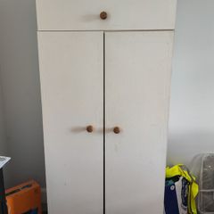 White wooden wardrobe with shelves