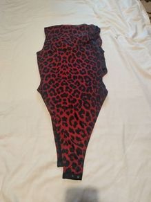 Sexy burgundy bodysuit for thin crossdresser