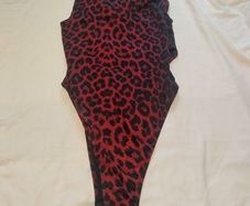 Sexy burgundy bodysuit for thin crossdresser