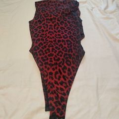 Sexy burgundy bodysuit for thin crossdresser