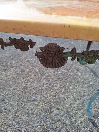 Vintage metal coffee table in need of restoration