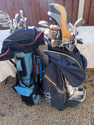 A selection of golf clubs and bags. All right handed clubs.