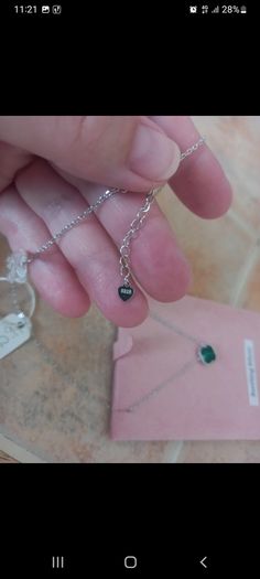 silver necklace with green stone