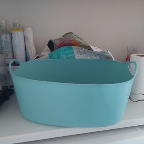 Large blue plastic laundry basket