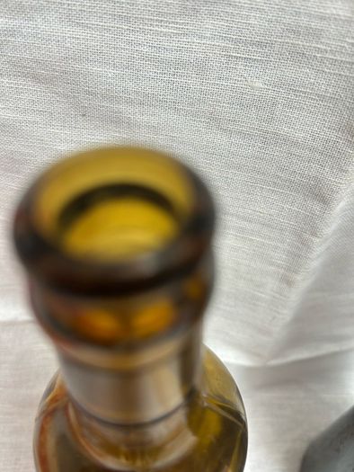 Antique Cork Advertising Bottles x2