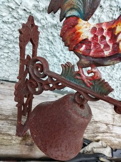 Charming rustic cast-iron rooster wall bell