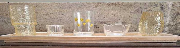 Decorative glasstealight holders on  wooden base