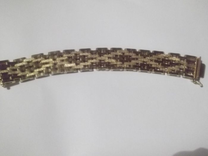 a heavy gold plated gate bracelet