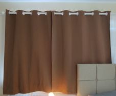 Pair of Brown Blackout Curtains with Eyelets
