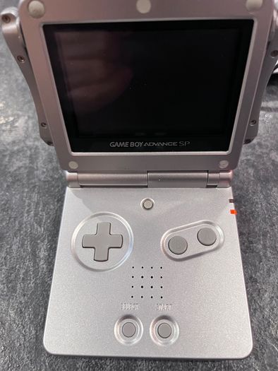 Nintendo Game Boy Advance SP Platinum Silver Mega Bundle - New Battery, USB Charger & 7 Games