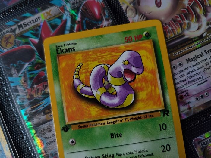 Ekans ! FIRST EDITION ! Rare Near Mint- Mint Condition ! from Team Rocket Set ! 2000 ! Pokemon Card !