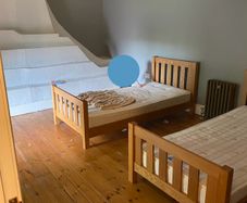 Two matching solid oak single beds.