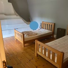 Two matching solid oak single beds.