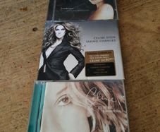 Celine Dion is featured on these CD albums,