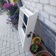 White wooden wall shelf with towel rail and hooks