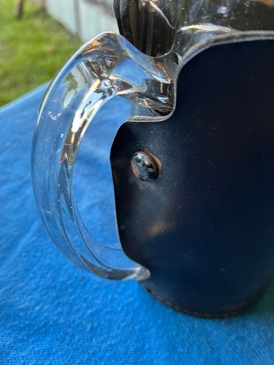 Vintage pint glass in leather holder