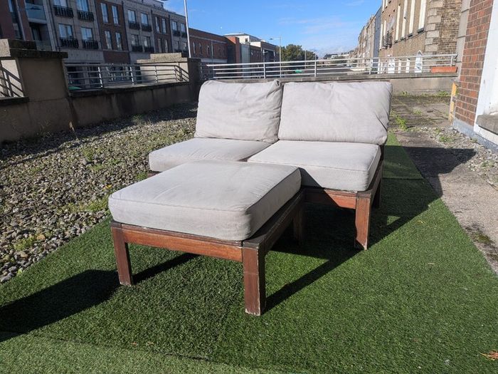 Wooden outdoor lounger with cushions