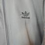 Adidas Firebird tracksuit top. Nice grey color. Black three stripes. New. Never worn. Image 3