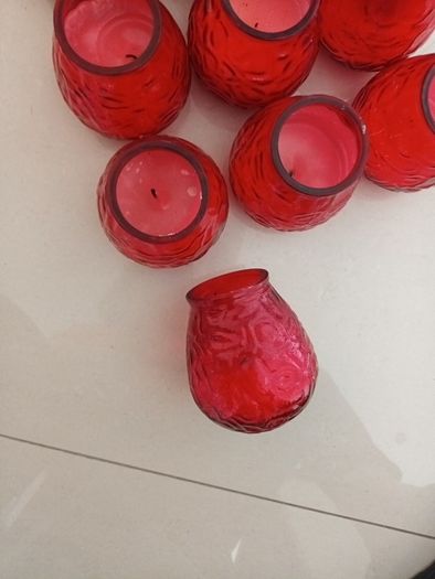 10 candles in red glass holders