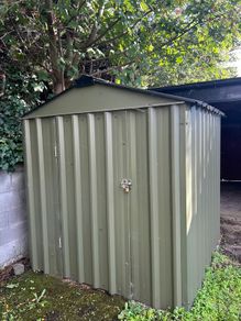 Green metal garden shed