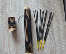 wooden incense holder tube and a small bundle  incense sticks