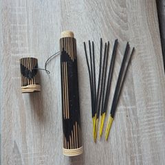 wooden incense holder tube and a small bundle  incense sticks