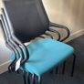 Office chairs with black frames and teal seats Image 2
