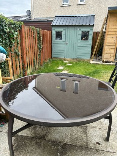 Round glass top garden table