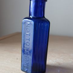 Rare Not To Be Taken 1/2oz blue glass bottle